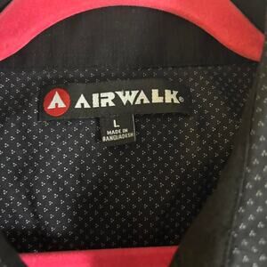 Airwalk black button up shirt with white polka dots. Size L